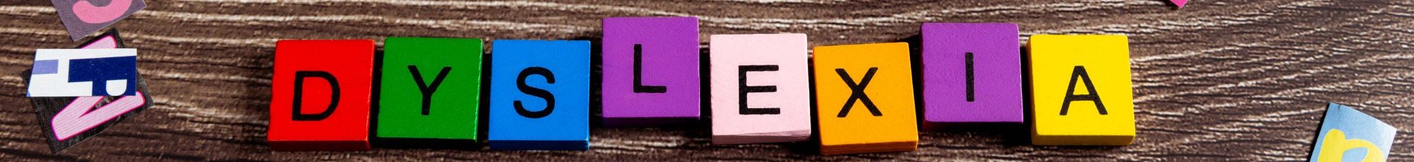Dyslexia spelled out in letter tiles.